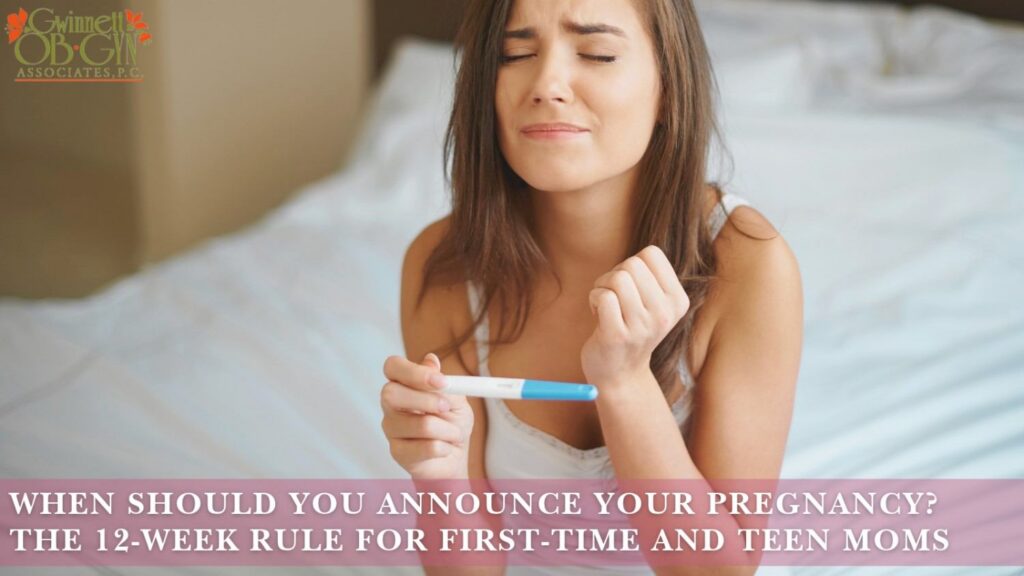 Young woman sitting on a bed and holding a pregnancy test, with text about when to announce a pregnancy and the 12-week rule for first-time and teen moms.